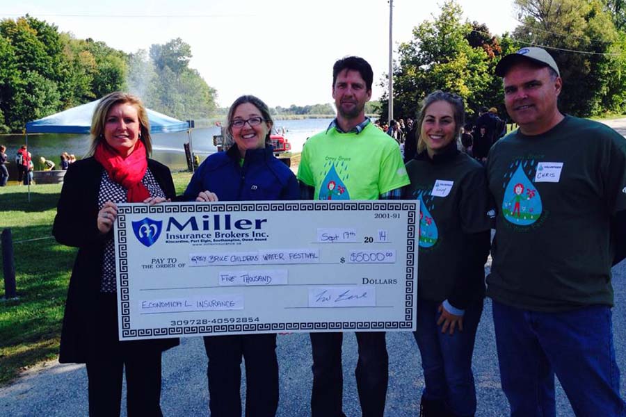 Community Involvement - Portrait of Miller Insurance Team Donating to the Grey Bruce Children's Water Festival