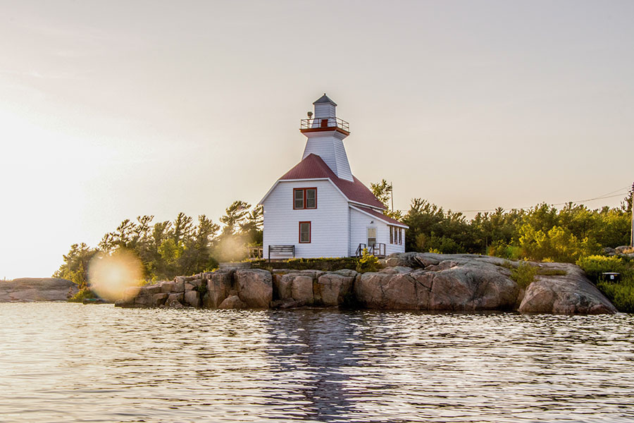 Contact - View of Lighthouse at Sunset Along the Coast in Ontario